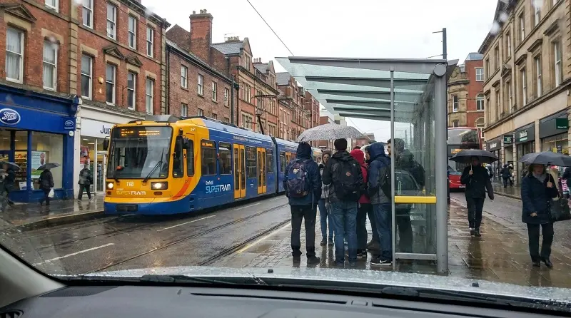 students commuting using sheffield supertram transport system